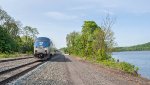 AMTK 85 at the head of The Maple Leaf  heading up the Hudson River at Stuyvesant, NY